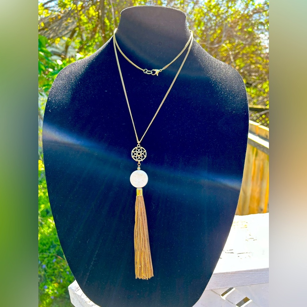 Chain and tassel necklace.